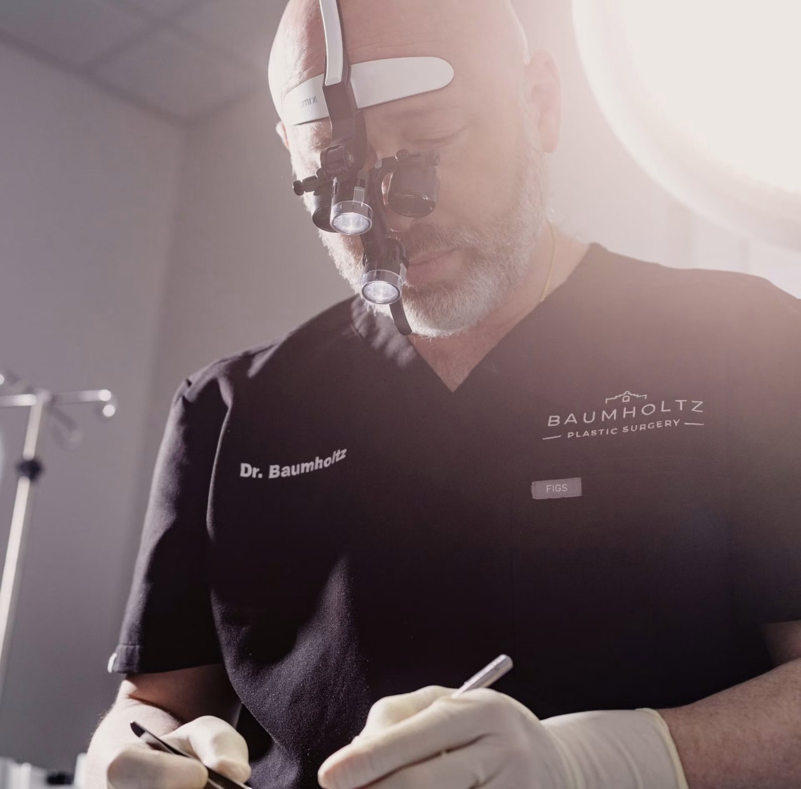 Dr. Michael Baumholtz performing surgery