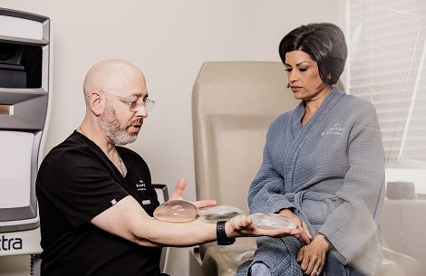 Doctor showing a patient results on a tablet